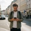 Traveller checking a phone on a street in Germany